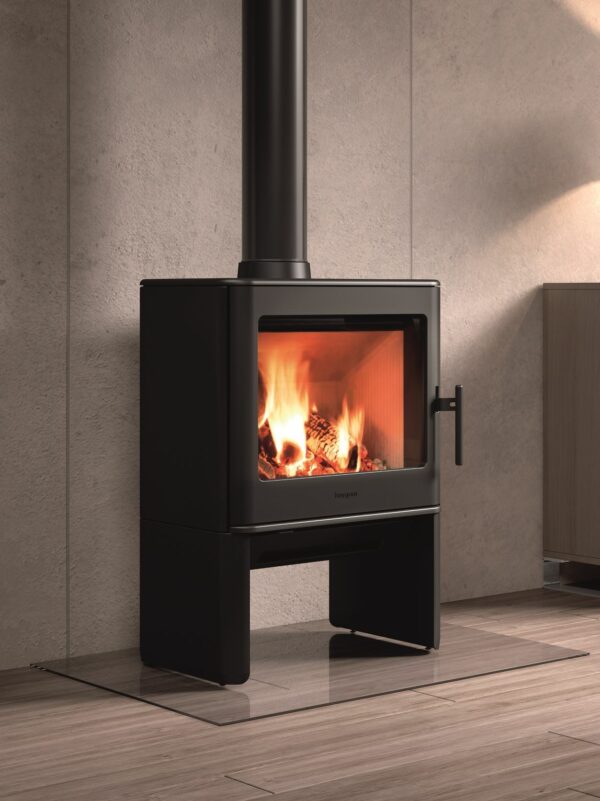 Castworks Hergóm E-40 freestanding wood fireplace with a modern design and glass front, suitable for cozy home heating.