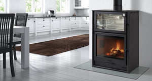 Castworks Hergóm Laredo wood fireplace with built-in cooker, showing the combination of fireplace and cooking surface in a modern design.