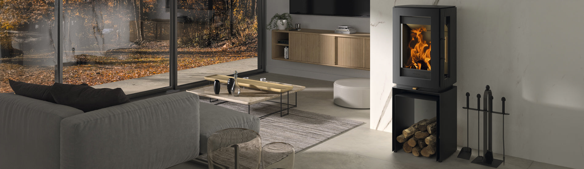 Castworks Hergóm Glow wood fireplace with a sleek design and glass front, showcasing a cozy fire burning inside.