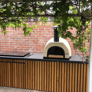 HVH60 Dome Preassembled Pizza Oven by HVH Pizza Ovens showing the stainless steel exterior and dome-shaped design for outdoor pizza cooking.