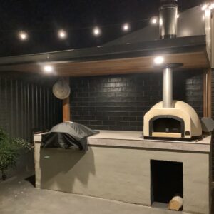 HVH70 Crema preassembled pizza oven from HVH Pizza Ovens, showcasing its compact design and creamy exterior finish.