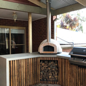 HVH70 Real Brick Preassembled Pizza Oven by HVH Pizza Ovens, showcasing the brick exterior and compact design for authentic homemade pizza.