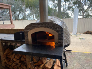 HVH70 Tiled Preassembled Pizza Oven by HVH Pizza Ovens, showcasing a durable tiled exterior and professional-grade pizza cooking surface