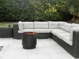 Stainless steel VisionLINE Outdoor Firepit with fire bowl and decorative exterior for outdoor fireplaces and gatherings.
