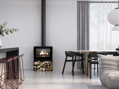 VisionLINE Phoenix Wood Stove in a cozy living room, showcasing its glass door and sleek black finish as a wood fireplace.