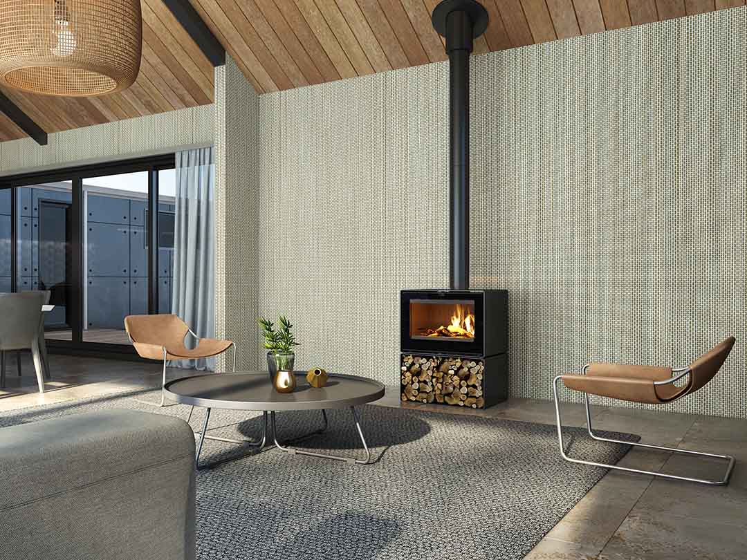 Wood fireplace by VisionLINE featuring the Phoenix Wood Stove with a modern design and glass front for cozy heating.